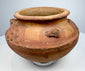 Historic Pre-Columbian pottery artifact with sculpted clusters, textured decoration, and centuries-old surface wear.