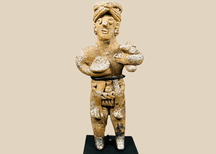 Ancient West Mexican standing terracotta figure with headdress and ornaments