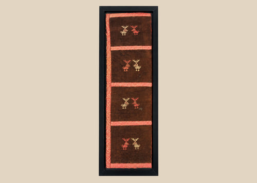 Ancient Pre-Columbian textile fragment featuring geometric animal motifs embroidered in red, gold, and tan thread on a dark brown woven ground, preserved in a protective display frame, dating to circa 1000–1400 CE, representing Andean artistry and symbolic ritual use.