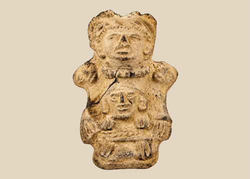 Ancient Pre-Columbian Veracruz ceramic effigy depicting two joined human figures, hand-modeled with stylized facial features and incised details, tan clay with surface wear and encrustation, dating to circa 300 BCE–600 CE, representing Mesoamerican ritual and symbolic artistry.