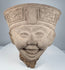 Classic Veracruz Sonriente terracotta head with expressive smile and elaborate geometric headdress