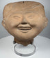 Pre-Columbian Veracruz Sonriente sculpture with open smiling mouth and raised headdress decoration