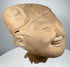 Classic Veracruz smiling face terracotta head with prominent scroll and geometric headdress motifs