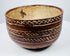 Ceramic bowl with alternating plain bands and interlocking X-shaped decoration.