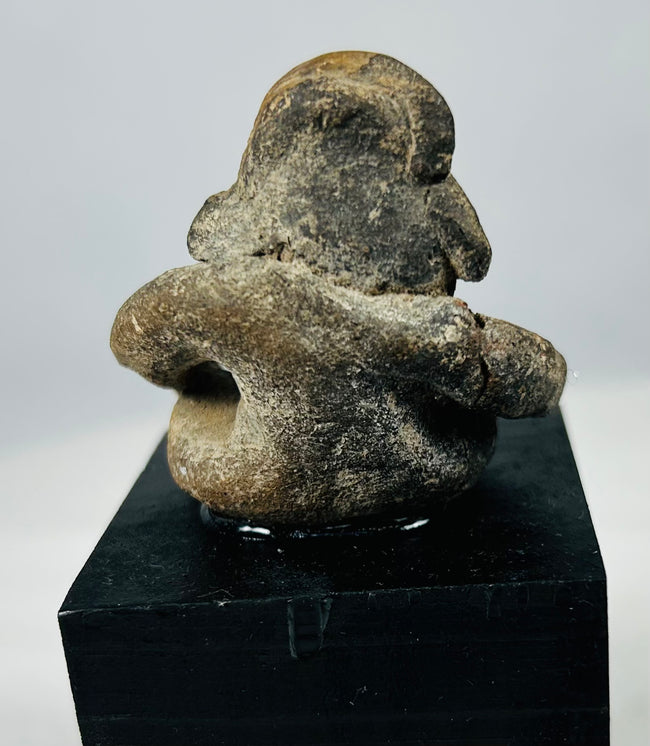 Pre-Columbian Mesoamerican terracotta effigy sculpture showing encrustation, age wear, and strong expression