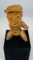 Ancient Mesoamerican terracotta seated figure with defined brows, open mouth expression, and ritual presence