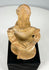 Pre-Columbian West Mexico shaft tomb terracotta figure seated with drum, displaying detailed cultural craftsmanship