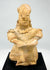 Hand-modeled ancient Mesoamerican terracotta drummer figure showing ear ornaments, drum, and earthen patina