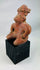 West Mexican ceramic tomb figure with pierced ears and elaborate headdress