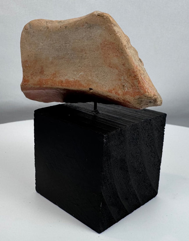 Ancient terracotta sculptural fragment representing a symbolic animal or spiritual being from the Pre-Columbian period.
