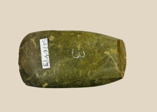 Authentic Pre-Columbian Andean ground-stone axe from Ecuador or Peru, 200–800 AD. Utilitarian tool with fully ground faces, steep beveled cutting edge, and rounded edge from repeated use. Original archaeological tag included. Reflects ancient craftsmanship, daily life, and technological skill of Andean civilizations.