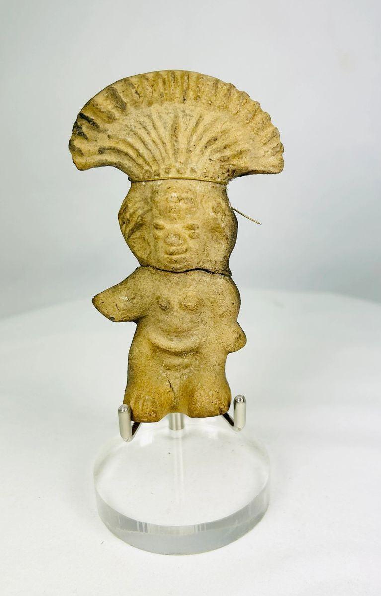 Pre-Columbian terracotta figurine with fan-shaped ceremonial headdress, circa 500–1500 CE