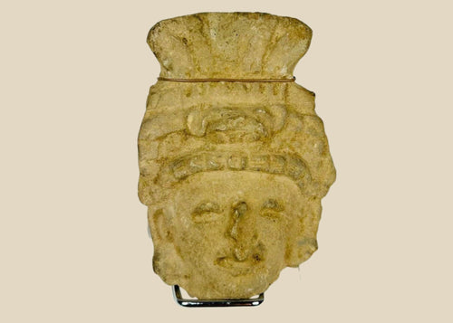 Pre-Columbian terracotta head fragment, circa 1st millennium CE, with stylized facial features and ornate fan-like headdress, weathered patina.