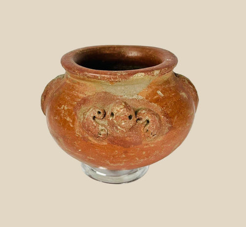 A late Pre-Columbian terracotta vessel with sculpted handles, ornamental motifs, and earthy red patina, dating to circa 1000–1500 CE.