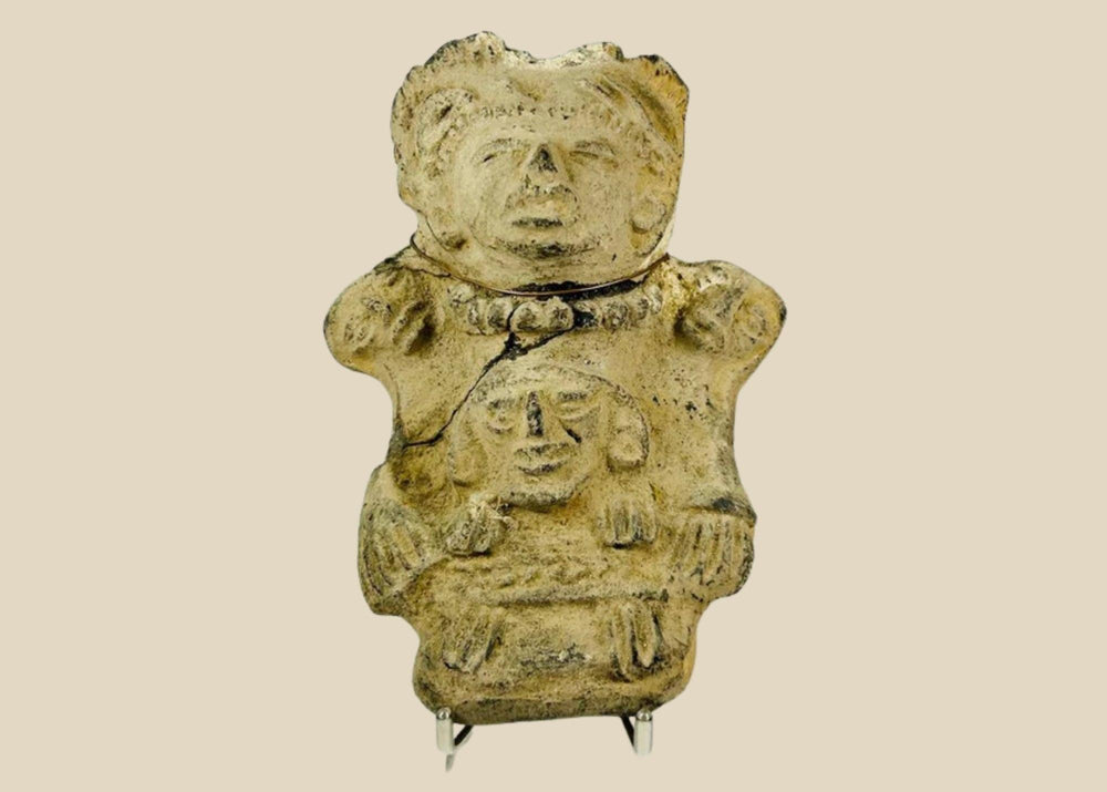 Ancient Pre-Columbian Veracruz ceramic effigy depicting two joined human figures, hand-modeled with stylized facial features and incised details, tan clay with surface wear and encrustation, dating to circa 300 BCE–600 CE, representing Mesoamerican ritual and symbolic artistry.