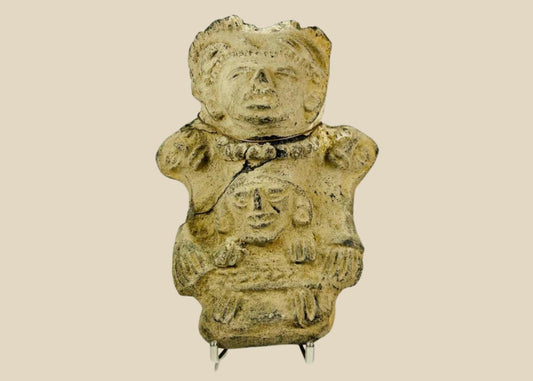 Ancient Pre-Columbian Veracruz ceramic effigy depicting two joined human figures, hand-modeled with stylized facial features and incised details, tan clay with surface wear and encrustation, dating to circa 300 BCE–600 CE, representing Mesoamerican ritual and symbolic artistry.