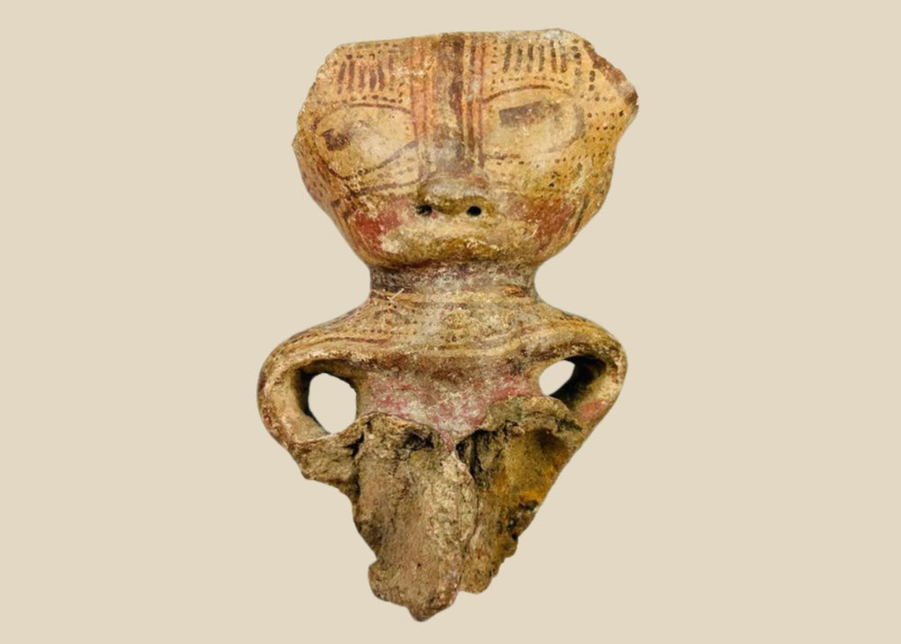 Ancient Pre-Columbian West Mexican terracotta figurine fragment, dating circa 300 BCE–300 CE, depicting a stylized human figure with incised facial features, hollow body form, and traces of red pigment; culturally significant artifact from early shaft tomb traditions, showing archaeological wear and breakage consistent with great age.