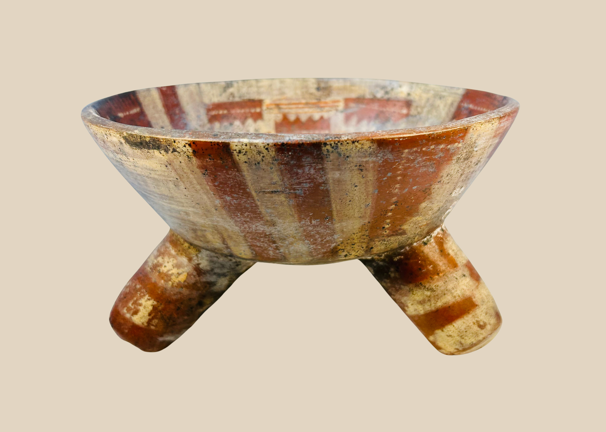 Ancient Mesoamerican tripod bowl showing archaeological surface deposits