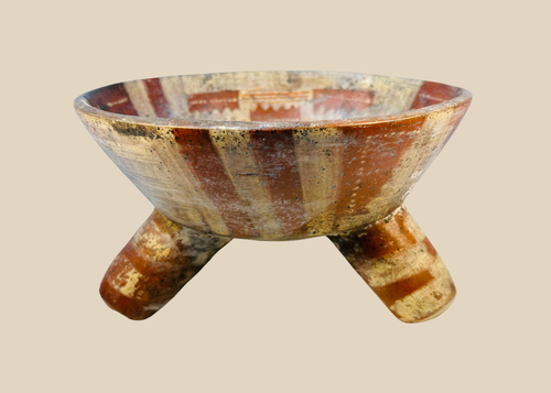 Ancient Mesoamerican tripod bowl showing archaeological surface deposits