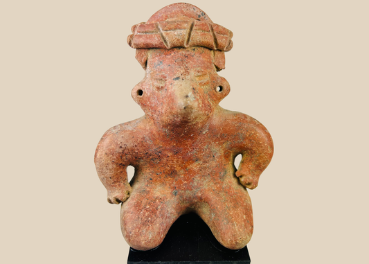 Pre-Columbian West Mexico terracotta figure with headdress on museum stand