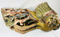 Angled view of Qing Dynasty phoenix relief sculpture carved from camphor wood, featuring gilded wings, red and blue polychrome pigments, and ornate openwork detailing – Relic and Rarity.