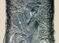Antique Qing Dynasty cast metal scholar’s tray intricately decorated with figures of Daoist immortals among swirling cloud motifs, featuring detailed robes, flowing hair, and symbolic patterns; used as a scholar’s desk accessory for brushes or offerings, with dark aged patina highlighting fine craftsmanship from 18th–19th century China.