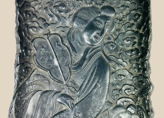 Antique Qing Dynasty cast metal scholar’s tray intricately decorated with figures of Daoist immortals among swirling cloud motifs, featuring detailed robes, flowing hair, and symbolic patterns; used as a scholar’s desk accessory for brushes or offerings, with dark aged patina highlighting fine craftsmanship from 18th–19th century China.