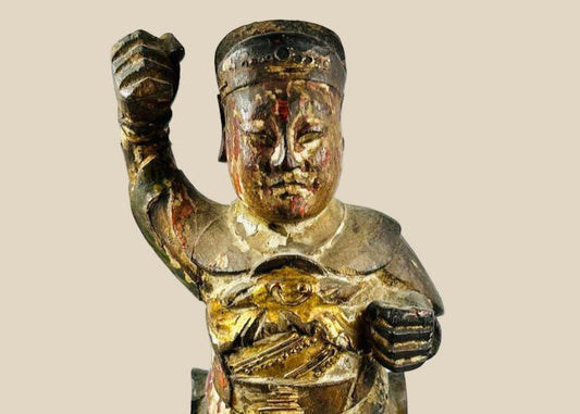 Carved and painted Qing Dynasty wooden statue of Wei Tuo Pusa (Skanda), 11 inches tall, depicting a warrior guardian with intricate armor, traces of red, gold, and black pigment, mounted on a black wooden base, Early 19th Century.
