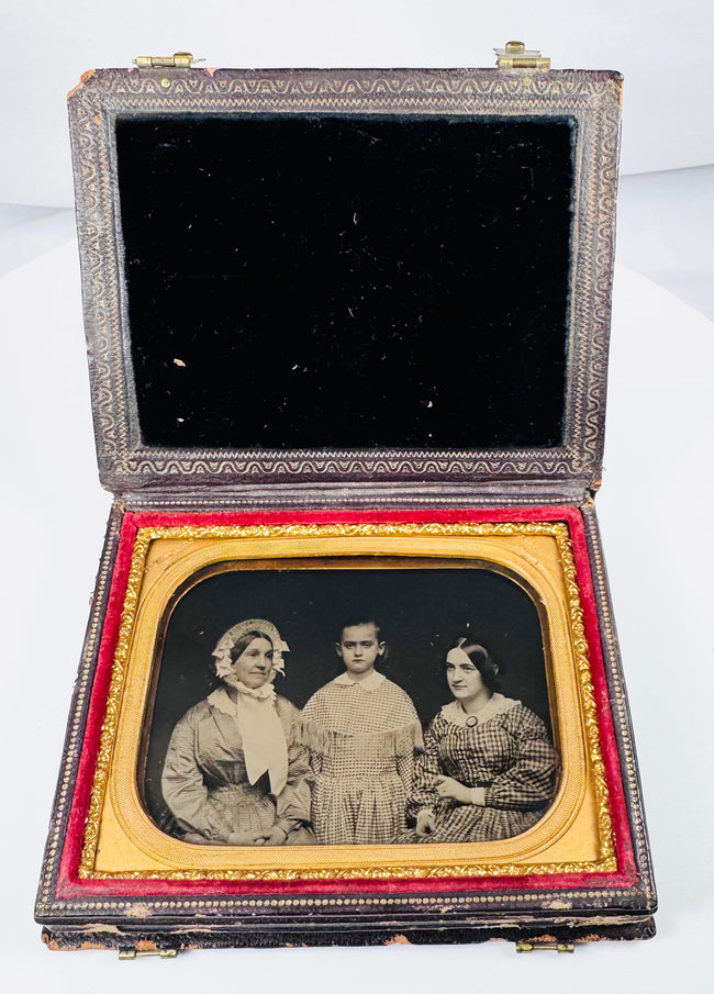 Mid-19th-century family ambrotype portrait of two women and a young girl