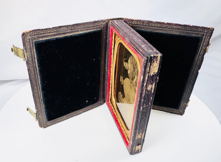 Victorian cased ambrotype with women wearing gingham dresses and an elaborate bonnet