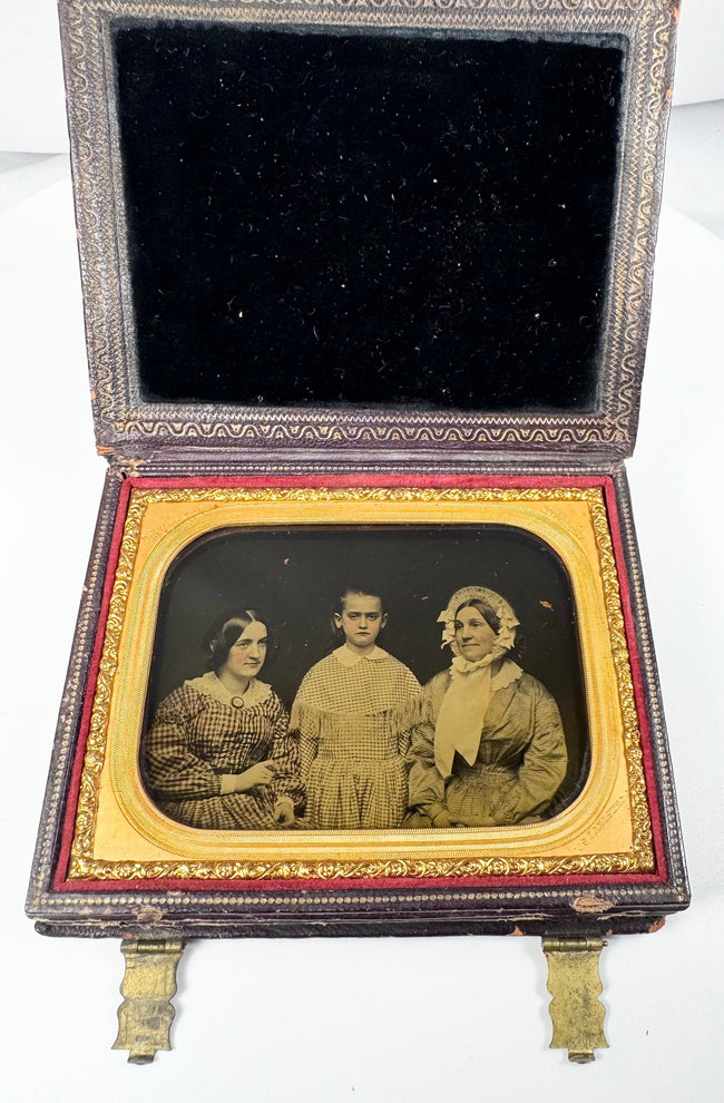 Antique Rehn ambrotype showing three female figures in a formal studio portrait