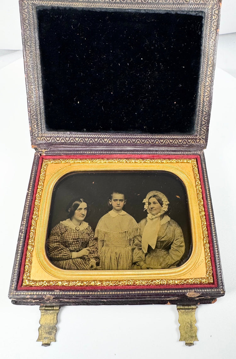 Antique Rehn ambrotype showing three female figures in a formal studio portrait