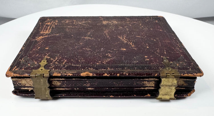Cased Victorian ambrotype featuring detailed clothing, bonnet ribbons, and period jewelry