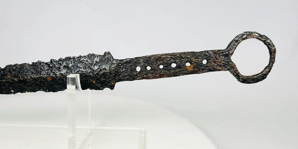 14th-century medieval European quillon dagger with tapered blade, crossguard, and ring pommel, forged steel and iron construction with aged patina.
