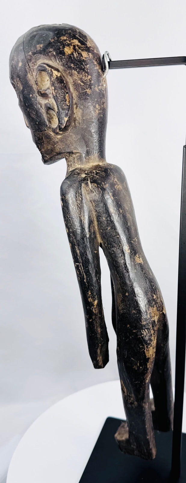 Full-length Rapa Nui-inspired skeletal wooden sculpture with carved hands, legs and feet