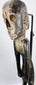 Antique Polynesian-inspired wooden figure with elongated limbs and weathered dark finish