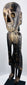 Detailed view of carved skeletal torso and rib cage on Rapa Nui-inspired wooden figure
