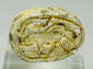 Underside of carved Egyptian scarab showing faint symbolic decoration