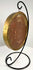 Gold-rimmed glass frame holding historical royal wax artifact
