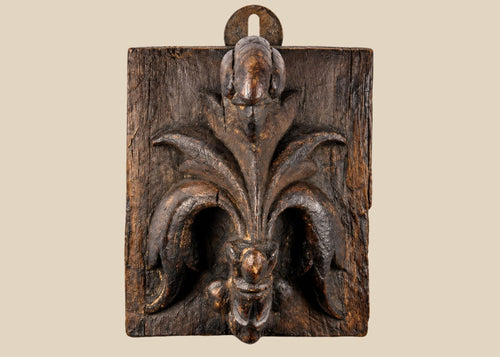 Small 16th-century European carved wooden devotional panel depicting the Pelican in Her Piety with zoomorphic scrollwork and traces of polychrome paint, Renaissance period.