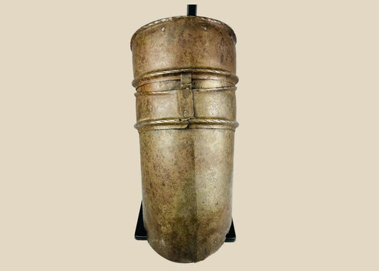 Renaissance knight’s upper arm defense, 16th-century cannon-style armor plate with riveted bands, aged surface, and mounted for display.