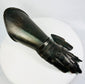 Right-hand articulated steel gauntlet photographed on white background with visible wrist lames and finger plates.