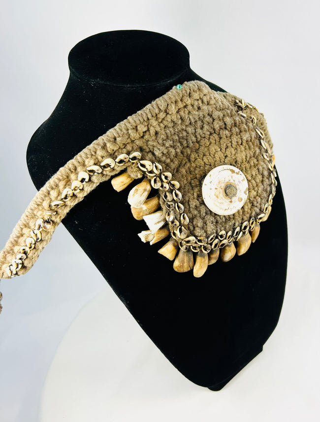 Antique Papua New Guinea tribal adornment with cowrie shell and animal teeth
