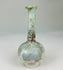 Ancient Roman glass bottle displaying elegant proportions, flared mouth, and iridescent sheen.