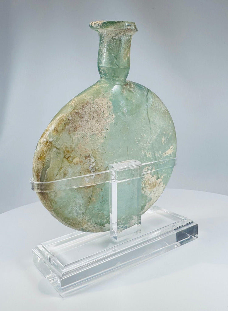 Free-blown Roman glass perfume vessel with flattened body and long cylindrical neck