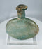 Ancient Roman cosmetic flask mounted on acrylic stand with authentic age-related weathering