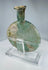 Ancient Roman pale green glass container with flared rim and custom display stand