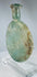 Roman Empire pale green glass vessel with burial weathering and elegant flattened profile