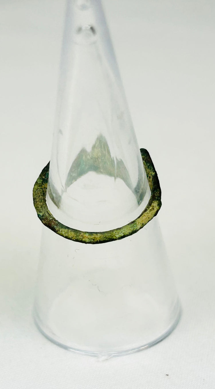 Back view of 2nd-century Roman bronze ring showing sculpted shoulders and gemstone clarity