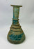 Authentic Roman glass bottle circa 1st–3rd century CE with encrusted turquoise coloration